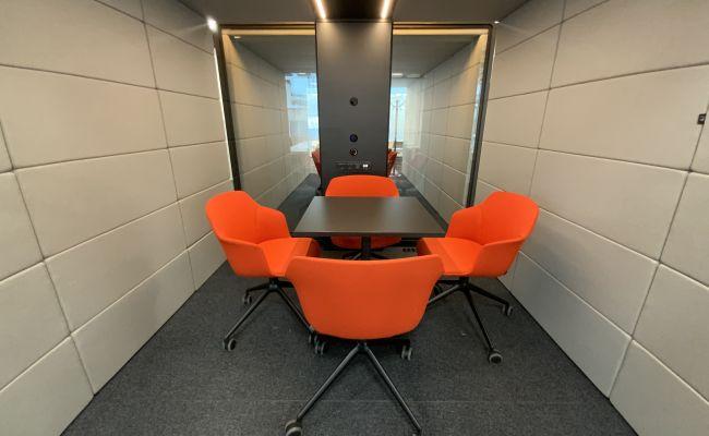Meeting room with red chairs
